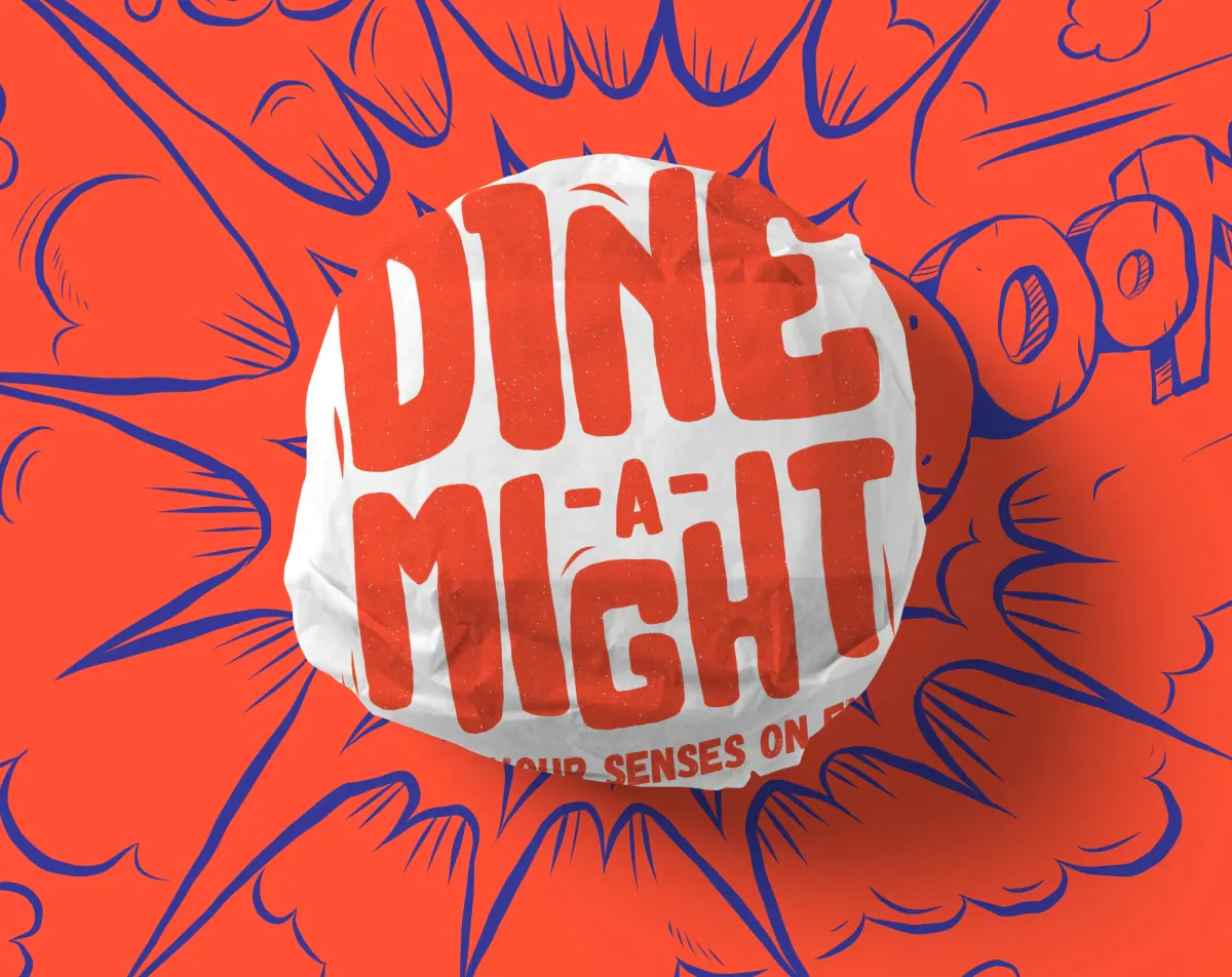Burger in a Dine-a-Might wrapper on a red and blue comic explosion