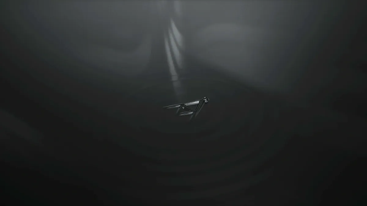 Triangle shape rising out of a dark liquid surface