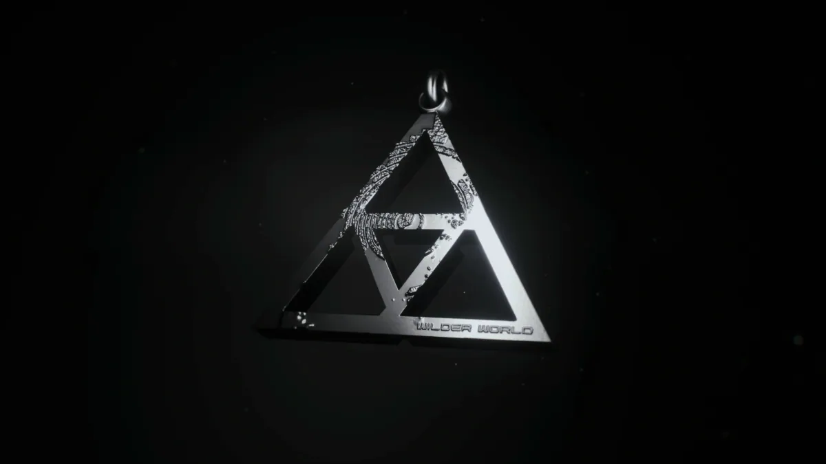 Silver triangle pendant engraved with Wilder World
