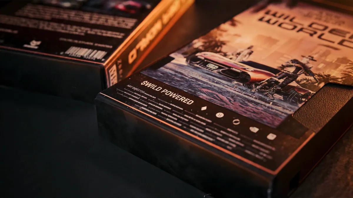 Close-up of the cover bottom edge reading $WILD Powered with rating icons