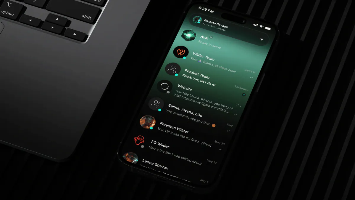 Phone beside a laptop showing the ZERO messenger chat list